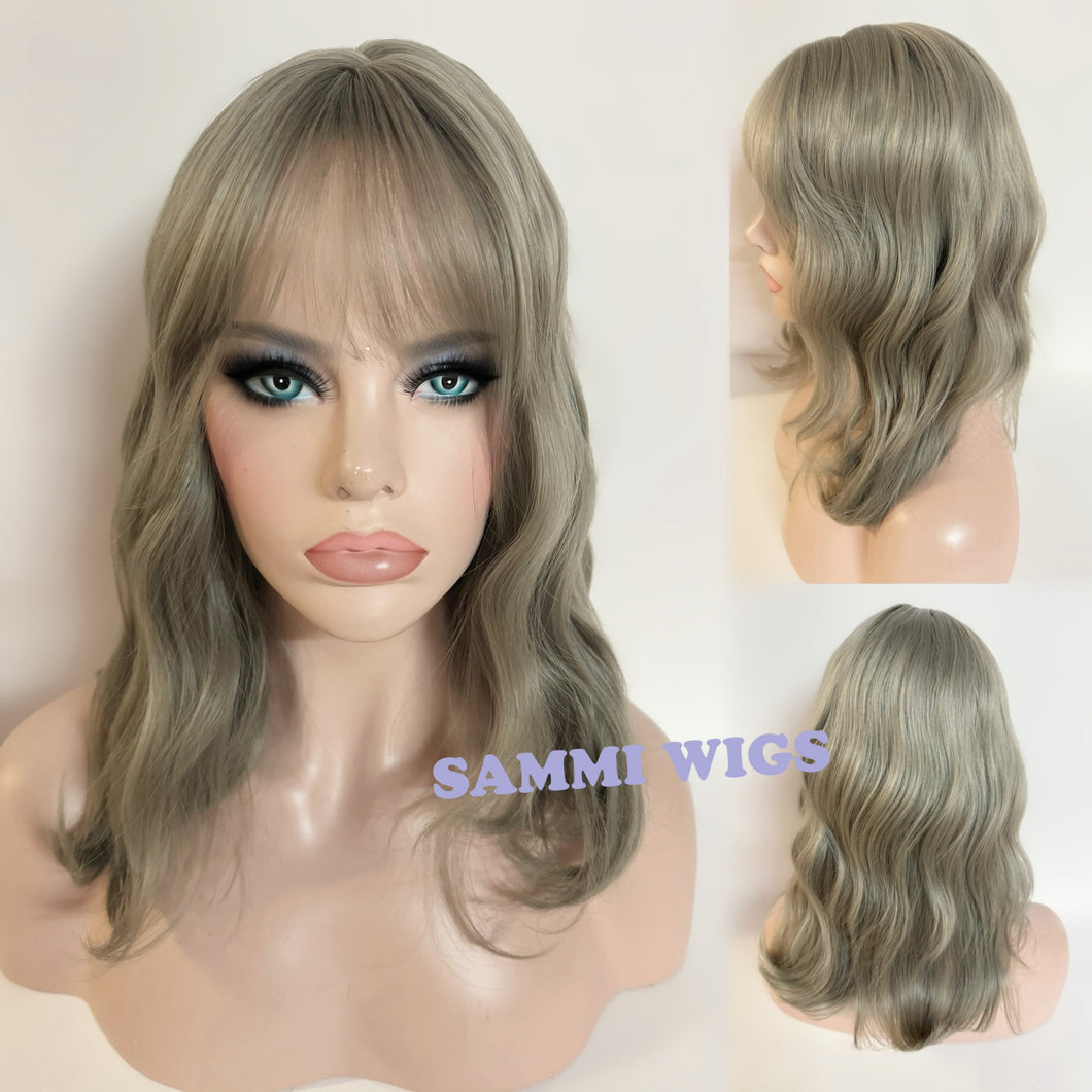 Shoulder length dusty green curly wig