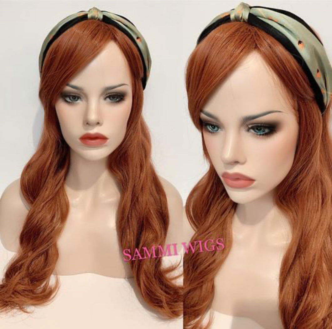 F708 Long curly wig in orange color