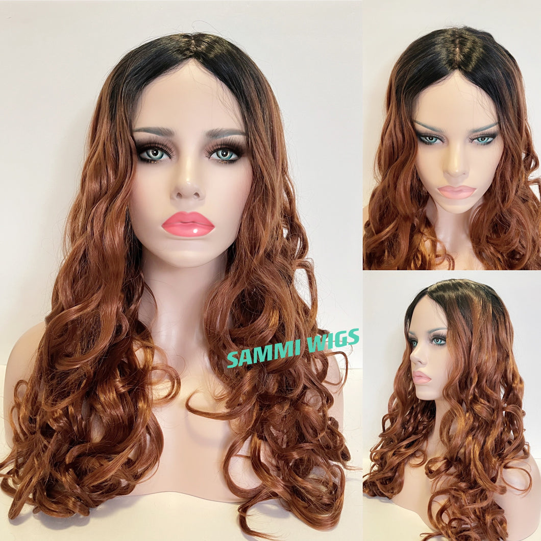 Long  curly wig with hand made monofilament in parting section in ombré from black to warm dark blond color