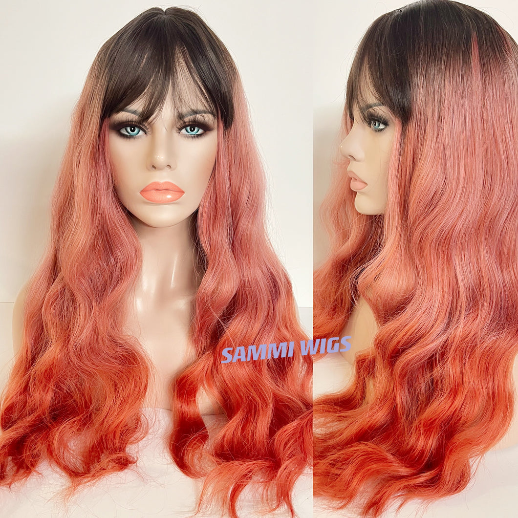 Long ombre to coral orange curly wig